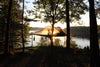 Hamac Tente au bord du lac sous un coucher de soleil